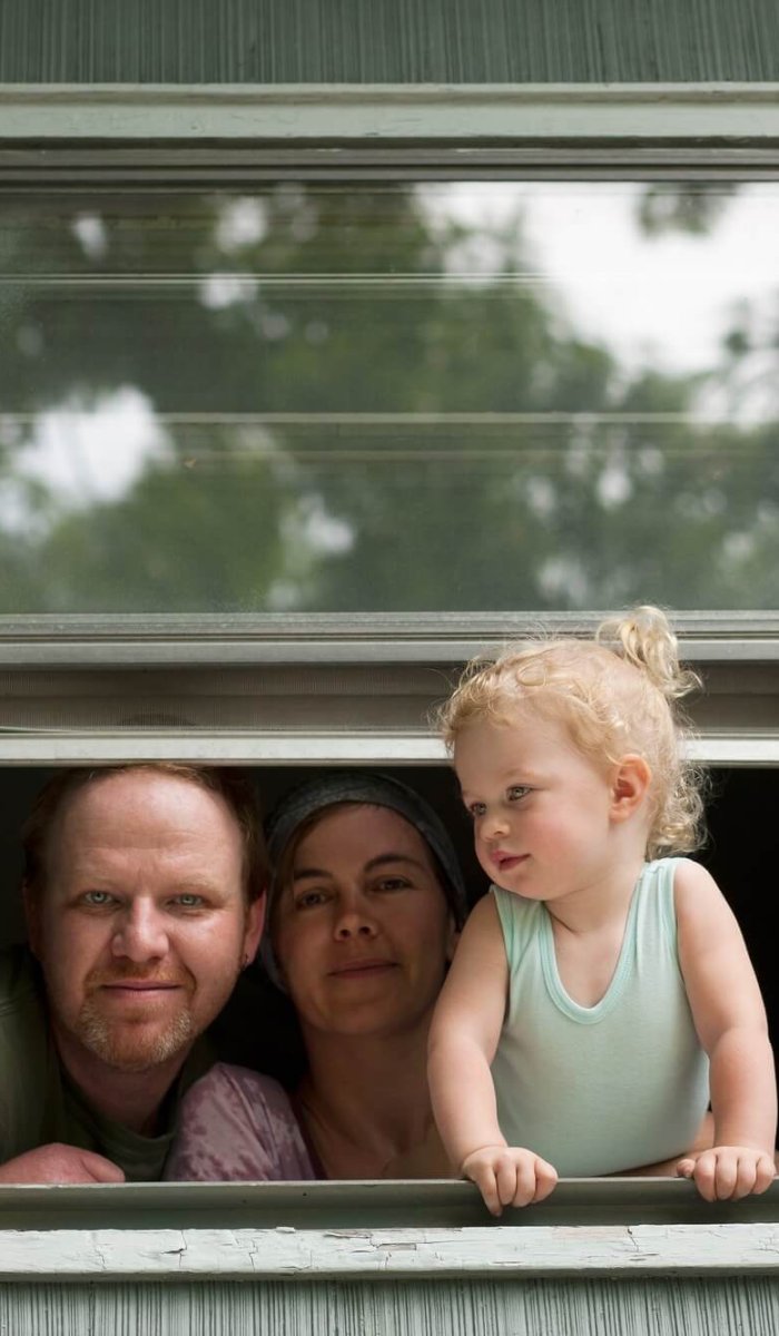 Family looking through window